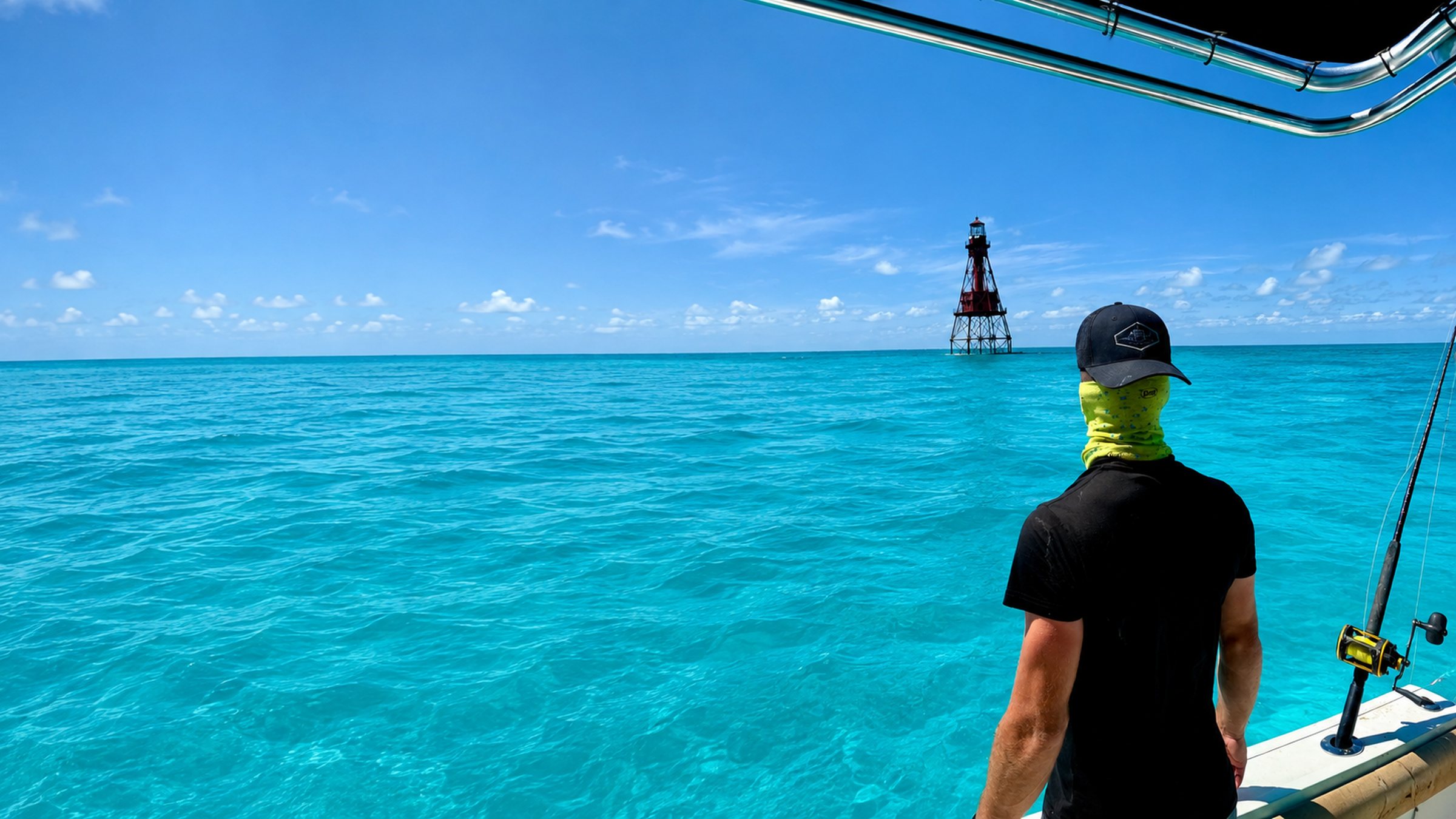 Watching the water at midday, lighthouse on the horizon